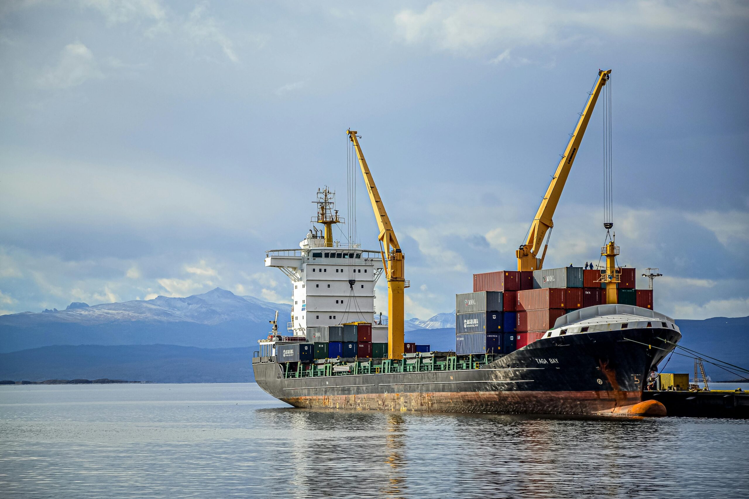 Cargo shipment from Dubai to Saudi Arabia with shipping containers on a truck