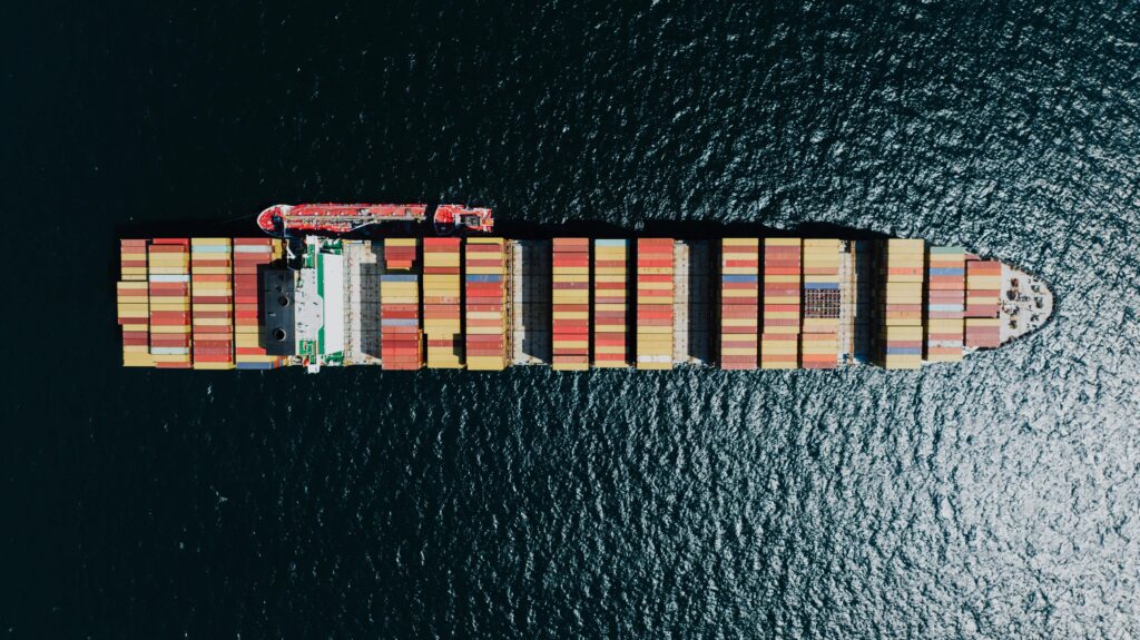 Cargo ship transporting goods from Dubai to Lisbon via sea.